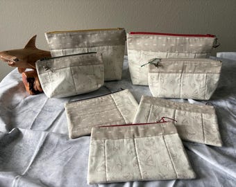 Beige shark tooth zipper bags