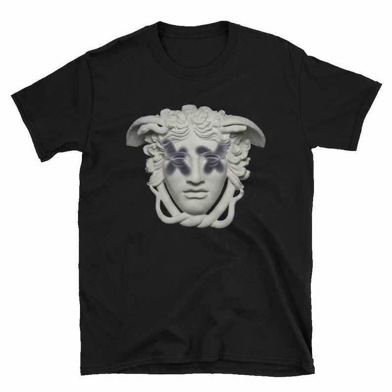 May include: Black t-shirt with a white graphic of a Medusa sculpture with black butterfly wings over her eyes.