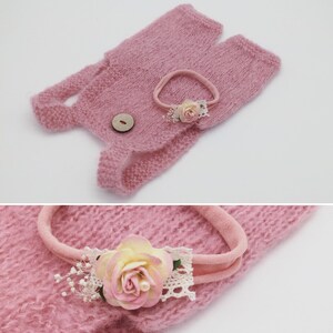 May include: A light pink knitted baby outfit set, including a romper with a wooden button closure and a matching headband. The headband features a large pink and yellow flower with lace and pearl accents. The set is designed for newborn photography.