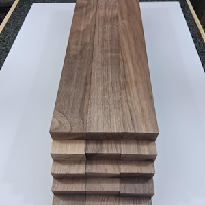 May include: A rustic wooden sign with the text "Welcome to our home" in a handwritten style. The sign features a distressed finish and a simple, inviting design, perfect for a front porch or entryway.