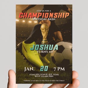 May include: A soccer-themed birthday invitation with the text "CHAMPIONSHIP BIRTHDAY BASH" in red and orange. The invitation features a soccer ball, a trophy, and a soccer player. The text reads "JOSHUA TURNS 10!" and includes the date and time.