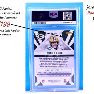 May include: A graded PSA 9 rookie card of Jordan Love, a Green Bay Packers quarterback. The card is numbered 96/199 and features a photo of Love in his uniform. The card is encased in a protective plastic case.