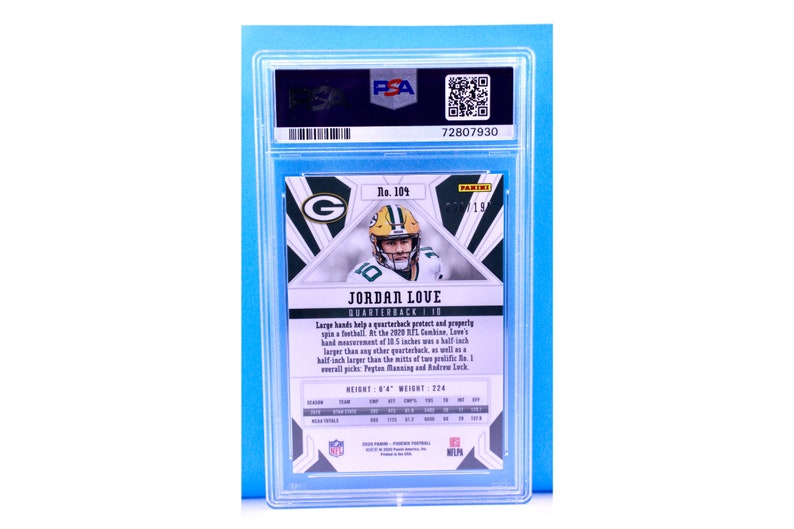 May include: A green and white football trading card featuring Jordan Love, a quarterback for the Green Bay Packers. The card is graded by PSA and has a number 104 printed on it. The card has a black and white geometric design with a green and white logo in the background. The card text reads "Large hands help a quarterback protect and properly spin a football. At the 2020 NFL Combine, Love's hand measurement of 10.5 inches was a half inch larger than any other quarterback, as well as a half inch larger than the mitts of two prolific No. 1 overall picks, Peyton Manning and Andrew Luck. HEIGHT 6'4" WEIGHT: 224"