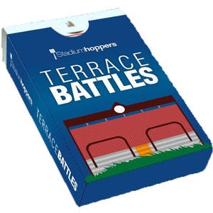 May include: A blue box with the text "Stadiumhoppers Terrace Battles" on the front. The box features a red and white illustration of a stadium with a green grass field.