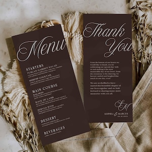 May include: Two tall, dark brown rectangular cards featuring white text. One card is titled Menu, listing starters, main courses, desserts, and beverages. The other card is titled Thank You, with a message from Sophia and Marcus dated 04.16.2022.
