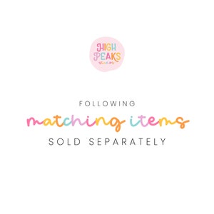May include: A pink circle with the text "HIGH PEAKS studios" in colorful letters. Below the circle, the text "FOLLOWING matching items SOLD SEPARATELY" in colorful letters.