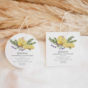 Può includere: Due etichette regalo bianche con un'illustrazione di limone e rosmarino. Il testo sulle etichette dice "Galentine's Simmering Potpourri Slice Lemon Add all ingredients to a saucepan, Cover with 2 c. of water, Simmer on low heat, add water as needed Homemade By: Autumn Smith"