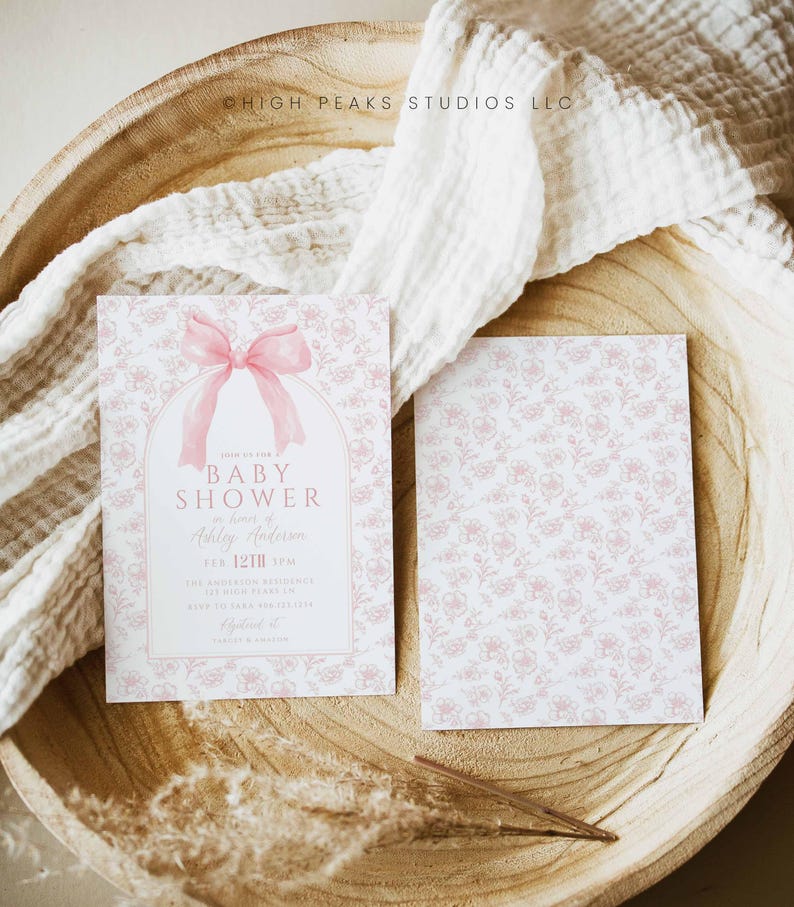 May include: A pink and white baby shower invitation with a pink bow and the text "Join us for a Baby Shower in honor of Ashley Anderson, Feb. 12th 3 PM, The Anderson Residence, 123 Main Street, Anytown, CA 12345, RSVP to Sarah at 123-456-7890".