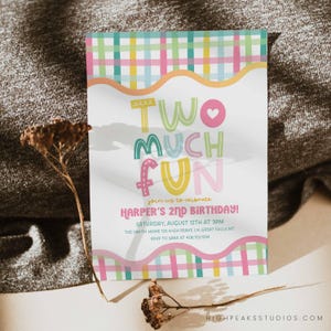May include: A colorful birthday invitation with the text "TWO MUCH FUN" in playful lettering. The invitation includes details for Harper's 2nd birthday, with a plaid border in pastel colors. The design is cheerful and festive.