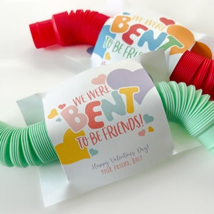 May include: A Valentine's Day card with a green and red bendy straw. The card says "We were bent to be friends!" with hearts and the text "Happy Valentine's Day! Your friend, Holt."