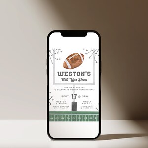 May include: A digital invitation for a first birthday party with a football theme. The invitation features a football, a football field, and the text "Weston's First Year Down". The invitation includes the date, time, and location of the party.