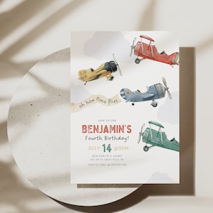 May include: A birthday invitation with a watercolor illustration of airplanes flying in the sky. The invitation is for Benjamin's Fourth Birthday on July 14th at 3 PM. The invitation includes the address and RSVP information.