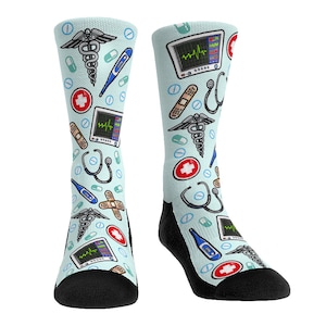 May include: A pair of light blue socks with a medical theme. The socks feature a variety of medical symbols, including a stethoscope, a caduceus, a thermometer, and a bandage. The socks are perfect for nurses, doctors, and other medical professionals.