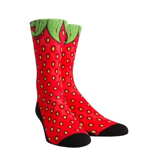 May include: A pair of red and green socks with a strawberry print. The socks have black toes and heels.