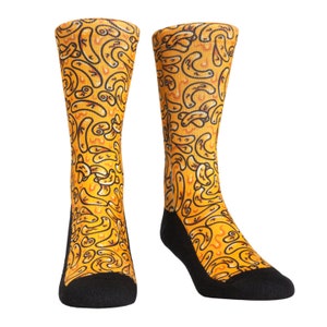 May include: A pair of yellow and black socks with a pattern of macaroni noodles. The socks are made of a soft, comfortable material and are perfect for everyday wear.