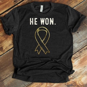 He Won Against Cancer T-Shirt - Big C Warrior - He Beat Cancer - Cancer Survivor - Childhood Cancer Awareness - Gold Ribbon