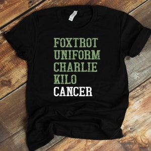 May include: Black t-shirt with the words "FOXTROT UNIFORM CHARLIE KILO CANCER" printed in green on the front.