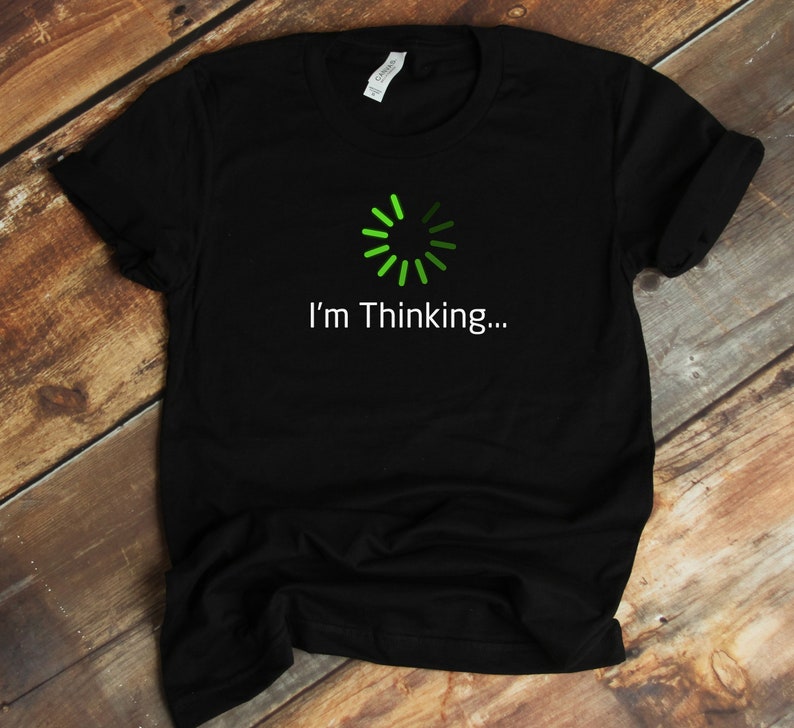 May include: Black t-shirt with a green loading icon and the text "I'm Thinking..."