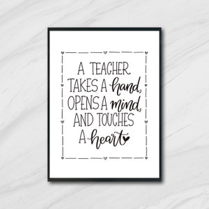 May include: Black and white printable quote art print with the text "A teacher takes a hand, opens a mind, and touches a heart." The quote is surrounded by a dashed line border and hearts.