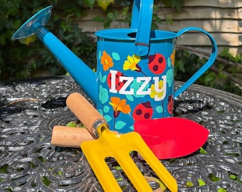 Regadera o juego de jardinería con forma de mariquita