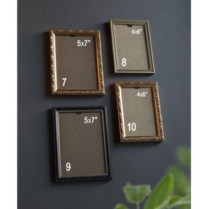 May include: Four rectangular picture frames in gold and black, with the dimensions 12.7x17.8 cm and 10.2x15.2 cm. The frames are displayed against a dark grey wall, with the numbers 7, 8, 9, and 10 visible.