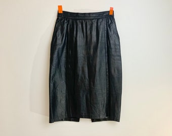 May include: A black leather skirt with a straight cut and a simple design.