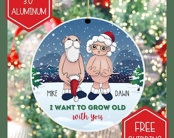 May include: A round Christmas ornament, approximately 7.6 cm in diameter, made of aluminium. It depicts a cartoon couple in Santa hats and boots, with the names "Mike" and "Dawn". The text "I WANT TO GROW OLD with you" is included.
