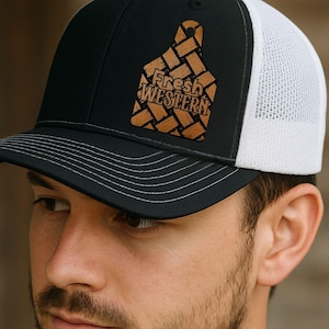 May include: Black and white trucker hat with a mesh back and a curved brim. The hat features a brown leather patch with the words "Fresh Western" and a cattle tag design. The image also includes the text "INSTANT DIGITAL DOWNLOAD".