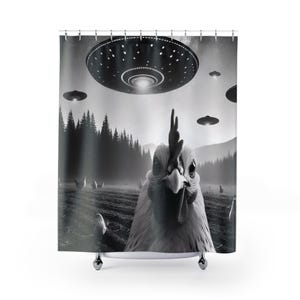May include: A black and white shower curtain featuring a close-up of a chicken's face with multiple flying saucers in the background.