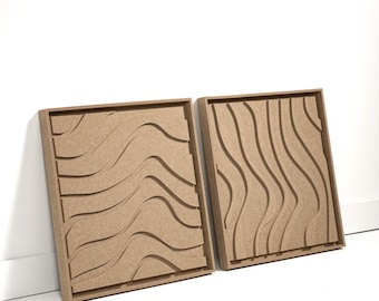 May include: Two square, light brown wooden wall art pieces. Each piece features a unique, carved, wavy design. The art pieces are displayed against a white wall, leaning slightly against it.