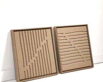 May include: Two square, wooden wall art pieces with geometric designs. One features vertical lines with staggered breaks, the other has horizontal lines. Both are in a natural wood tone, set against a white background.