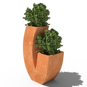 May include: A modern, terracotta-colored planter with two sections, each holding lush green foliage. The planter has a unique, curved design, creating a contemporary aesthetic. The overall shape is reminiscent of a stylized letter 'C'.
