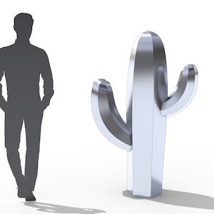 May include: A large, metallic silver cactus sculpture with two side arms. The sculpture is next to a human silhouette, providing a sense of scale. The cactus has a smooth, reflective surface and is set against a white background.