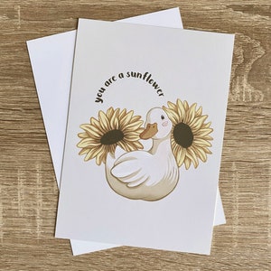 Ente & Sonnenblumen A6 Kunstdruck | Niedliche Geburtstags- oder Glückwunschkarte mit positiver Nachricht