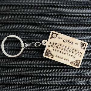 Mini Ouija Board Keychain – Engraved Wooden Charm for the Alt & Occult Soul
