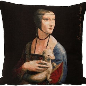 May include: A black and white tapestry pillow featuring a portrait of a woman holding a white weasel. The woman is wearing a blue and red dress and a pearl necklace. The pillow has the artist's signature, "Leonardo da Vinci", in the upper right corner.