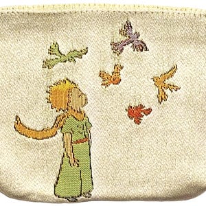 May include: Cream-colored pouch featuring an embroidered illustration of a young character in a green outfit, looking up at colorful birds. The pouch has a black drawstring closure and is made of a textured fabric.
