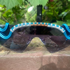 Black futuristic lens wire wrapped unisex sunglasses