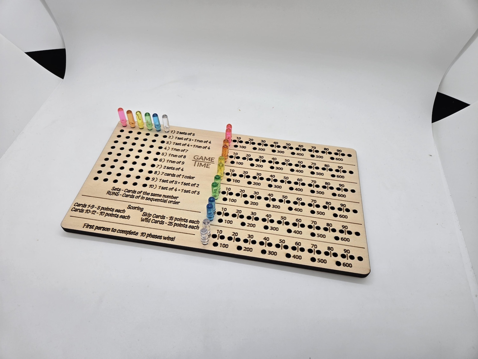 Phase 10 scoreboard with pegs