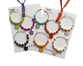 Set of 6 Charming Charms! Gorgeous handmade enamel flower Wine Charms. Personalised gift card.