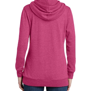 May include: A magenta hoodie with a drawstring hood and long sleeves. The back view of the hoodie shows a ribbed hem and cuffs. The fabric has a heathered texture. The hoodie is a casual garment.