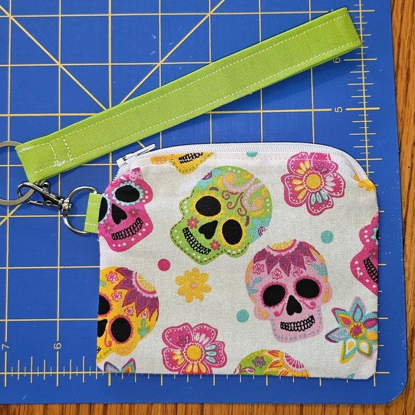 Sugar skulls, bright green and colorful change purse, wristlet, zipper, 4X5 inch pocket with clip and removal keychain. Day of the dead.