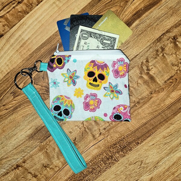 Sugar skulls, bright blue/teal and colorful change purse, wristlet, zipper, 4X5 inch pocket with clip and removal keychain. Day of the dead.
