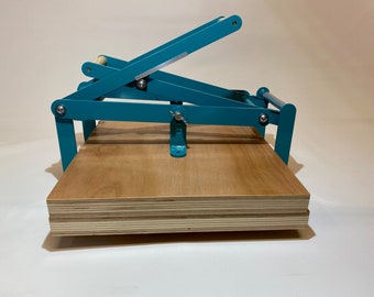 A2 size hand lino press, lino cut press, double lever operated, double US tabloid/ ledger size. Color: Ral 5018 turquoise