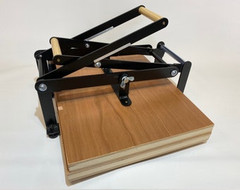 A2 size hand lino press, lino cut press, double lever operated, double US tabloid/ ledger size. Color: mattblack