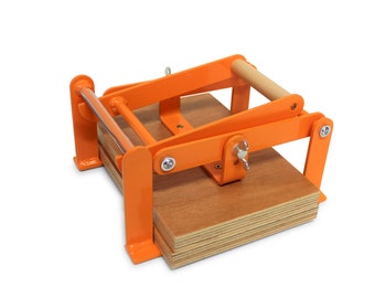 A5-size (junior legal+) hand relief press (lino press, lino cut press), heavy duty, steel, powdercoated orange ral 2003