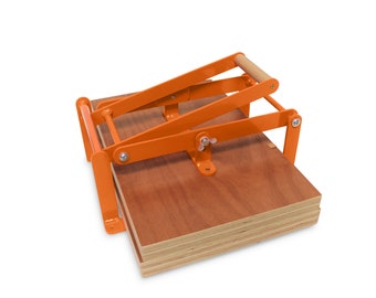 19 x 12,5 inch-size hand lino press, lino cut press, heavy duty, steel. Color: RAL 2004 orange