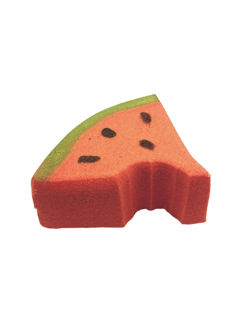 May include: A watermelon-shaped sponge with a bite taken out. The sponge is red with black seed details and a green rind. This item is designed for use in the kitchen or bathroom.