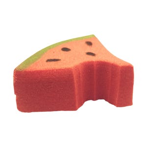 May include: A foam watermelon slice with a bite taken out. The slice is red with black seed details and a green rind. The shape is a triangle with a curved edge, suggesting a playful, food-themed item.