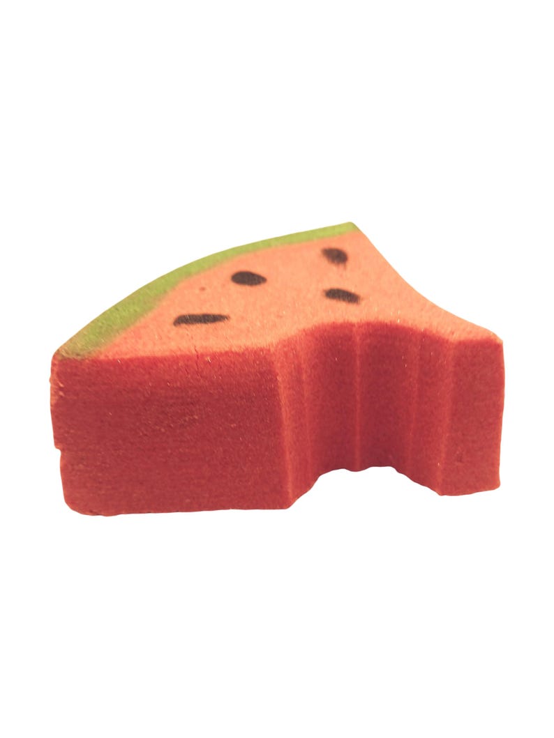 May include: A foam watermelon slice with a bite taken out. The slice is red with black seed details and a green rind. The shape is a triangle with a curved edge, suggesting a playful, food-themed item.